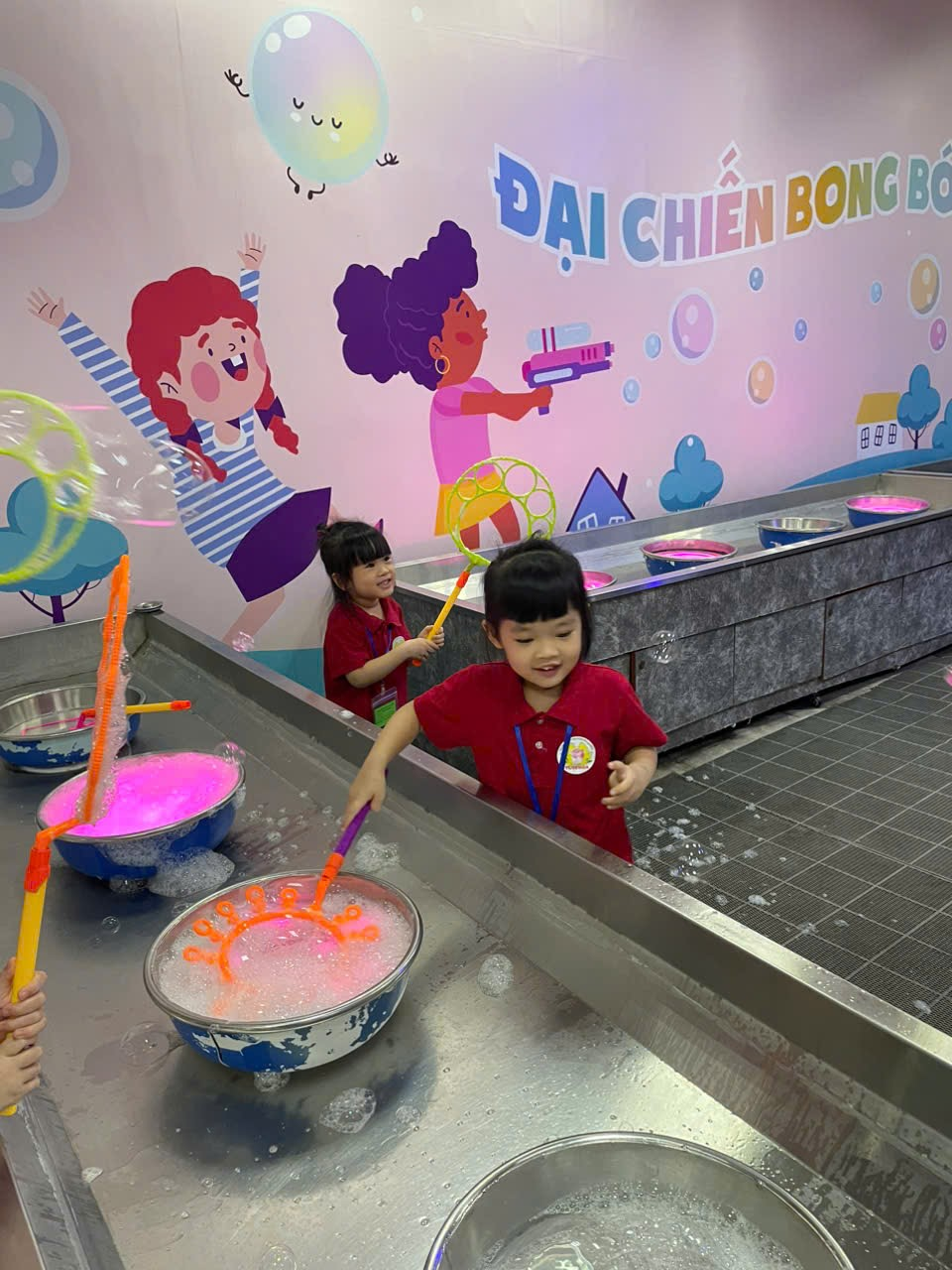 A group of children in red shirts

Description automatically generated