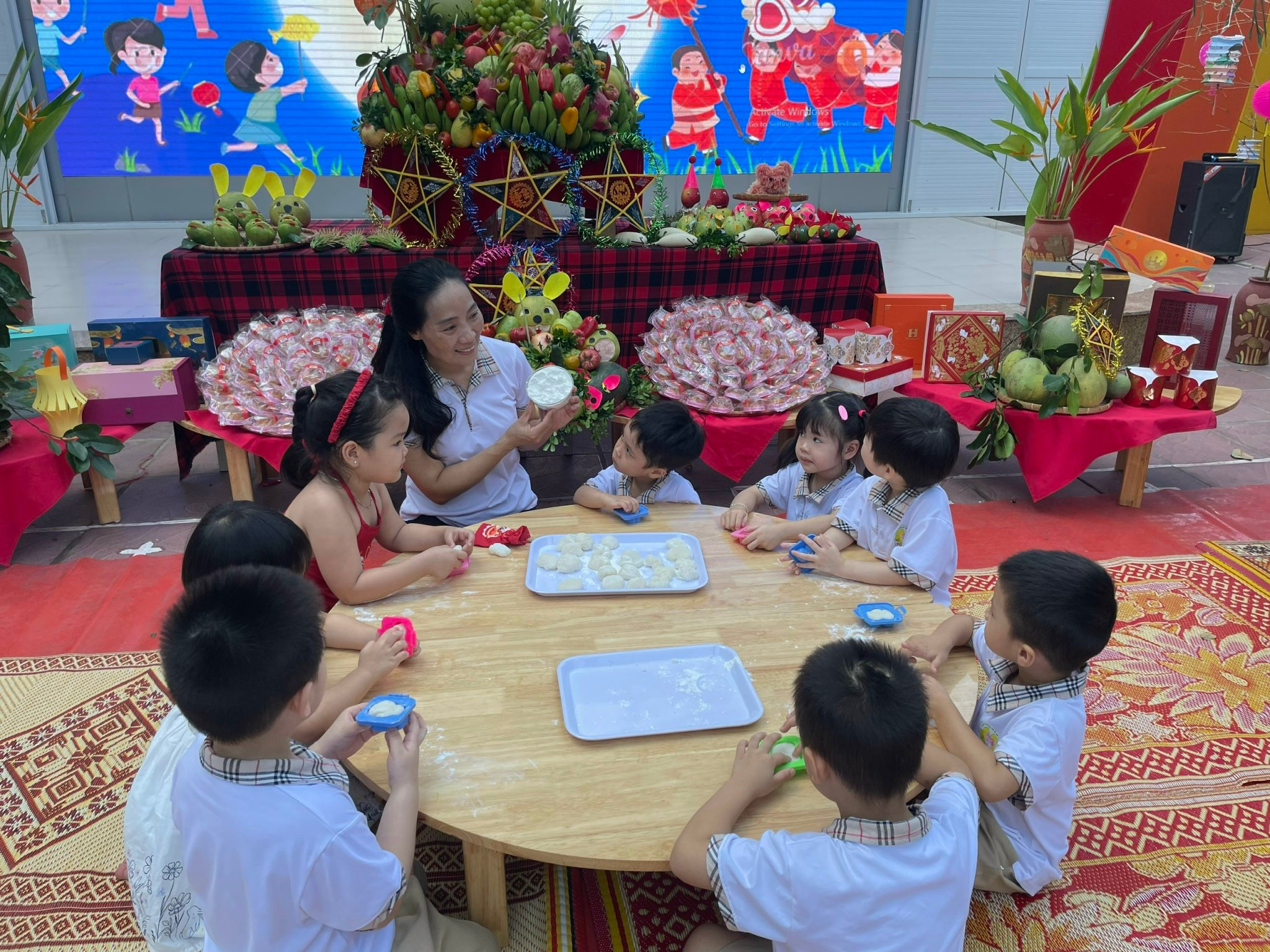 A group of children sitting around a table

AI-generated content may be incorrect.