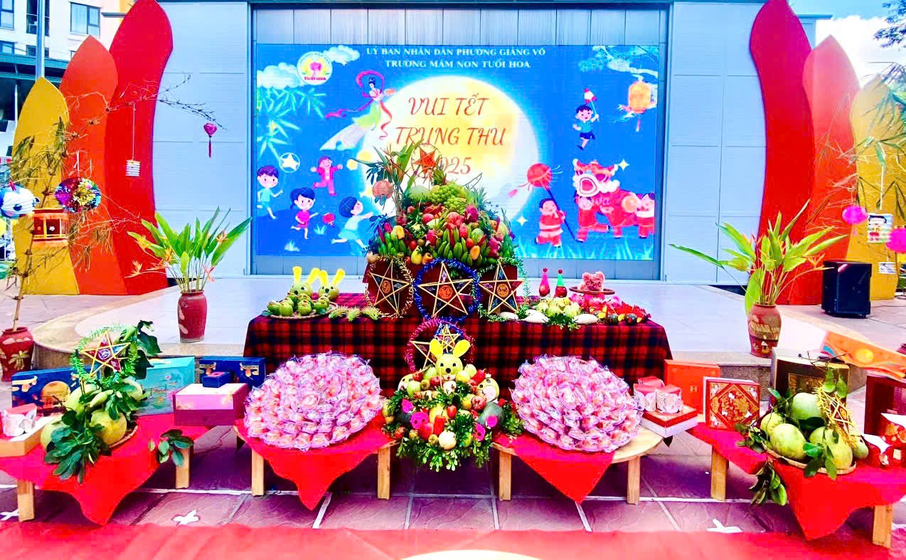 A stage with flowers and a poster

AI-generated content may be incorrect.