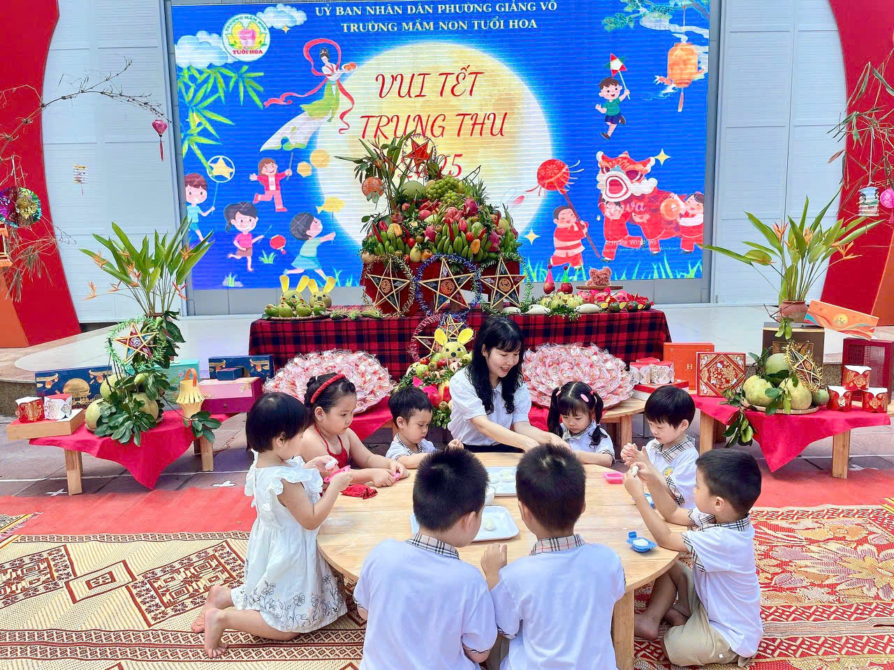 A group of children sitting around a table

AI-generated content may be incorrect.