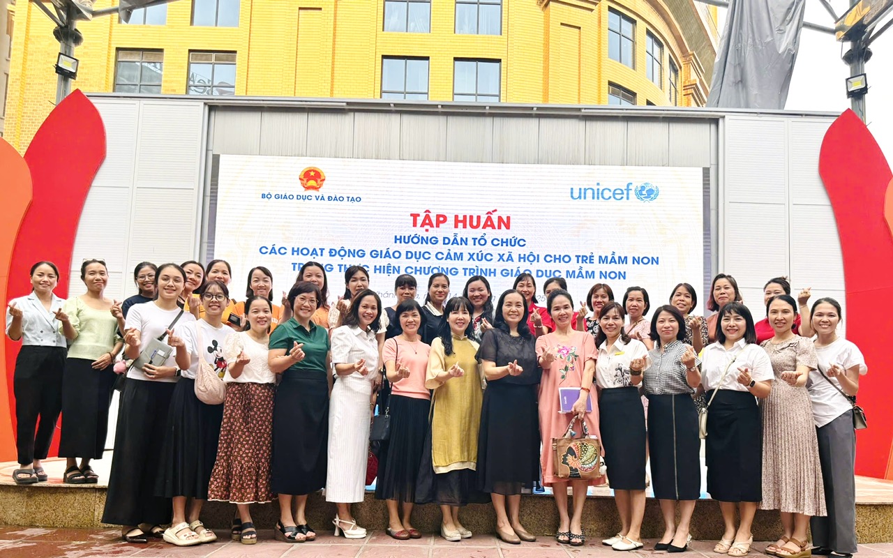 A group of women posing for a photo

AI-generated content may be incorrect.