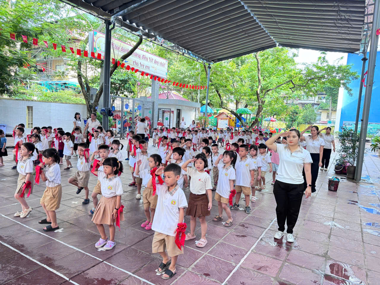 A group of children in school uniforms

Description automatically generated