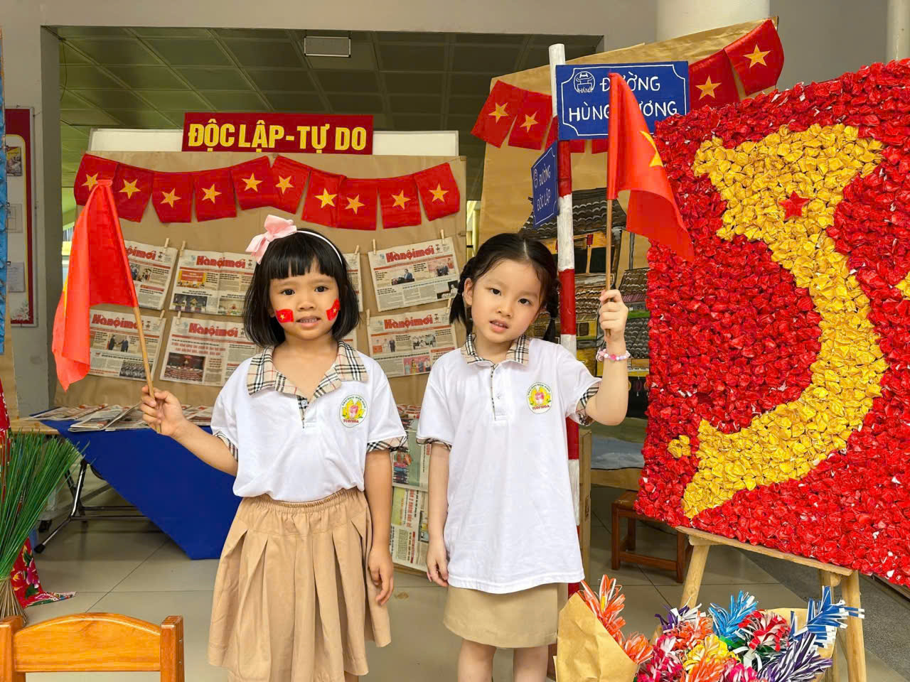 Two girls holding flags in a store

Description automatically generated