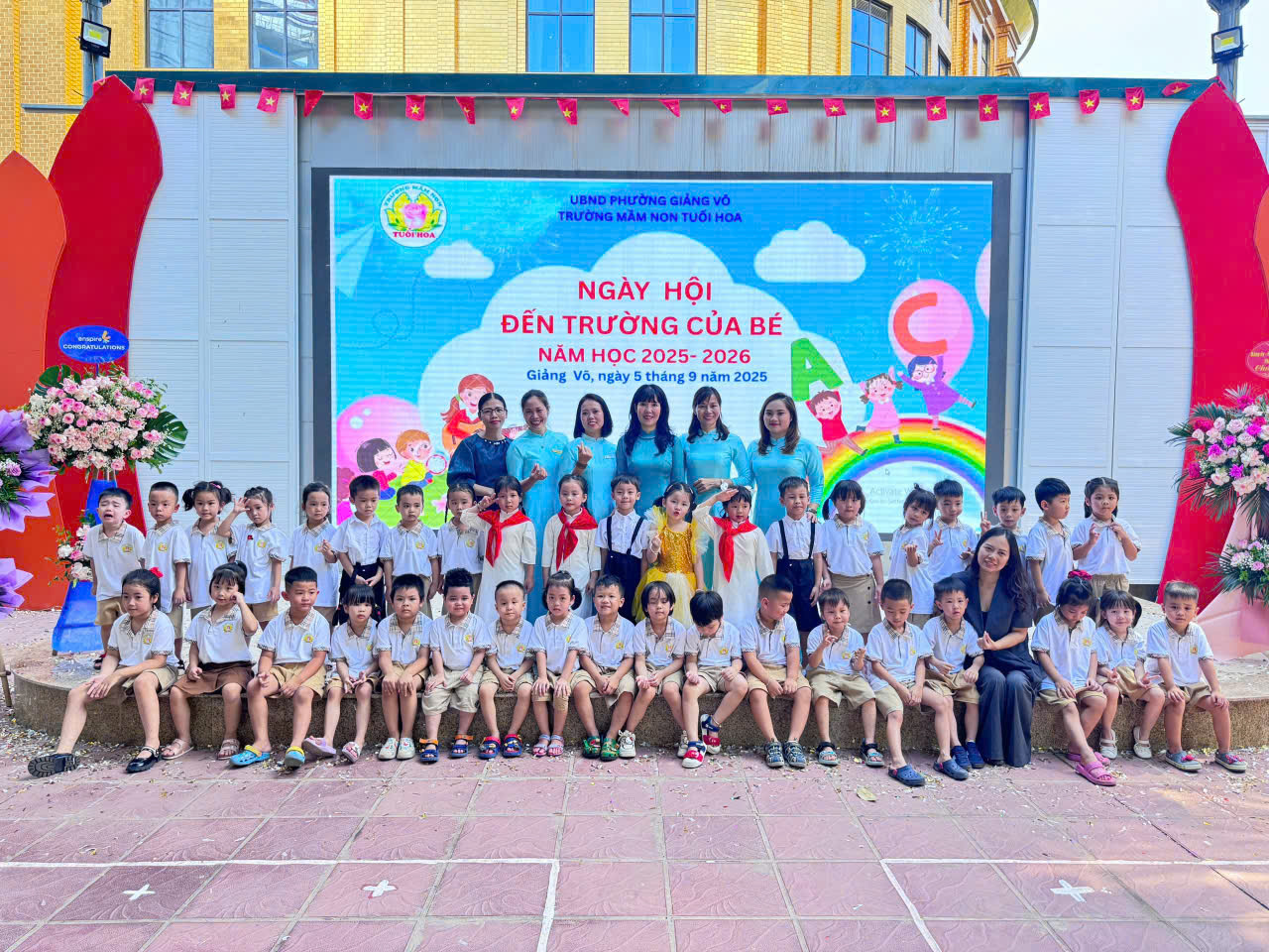 A group of children posing for a photoDescription automatically generated